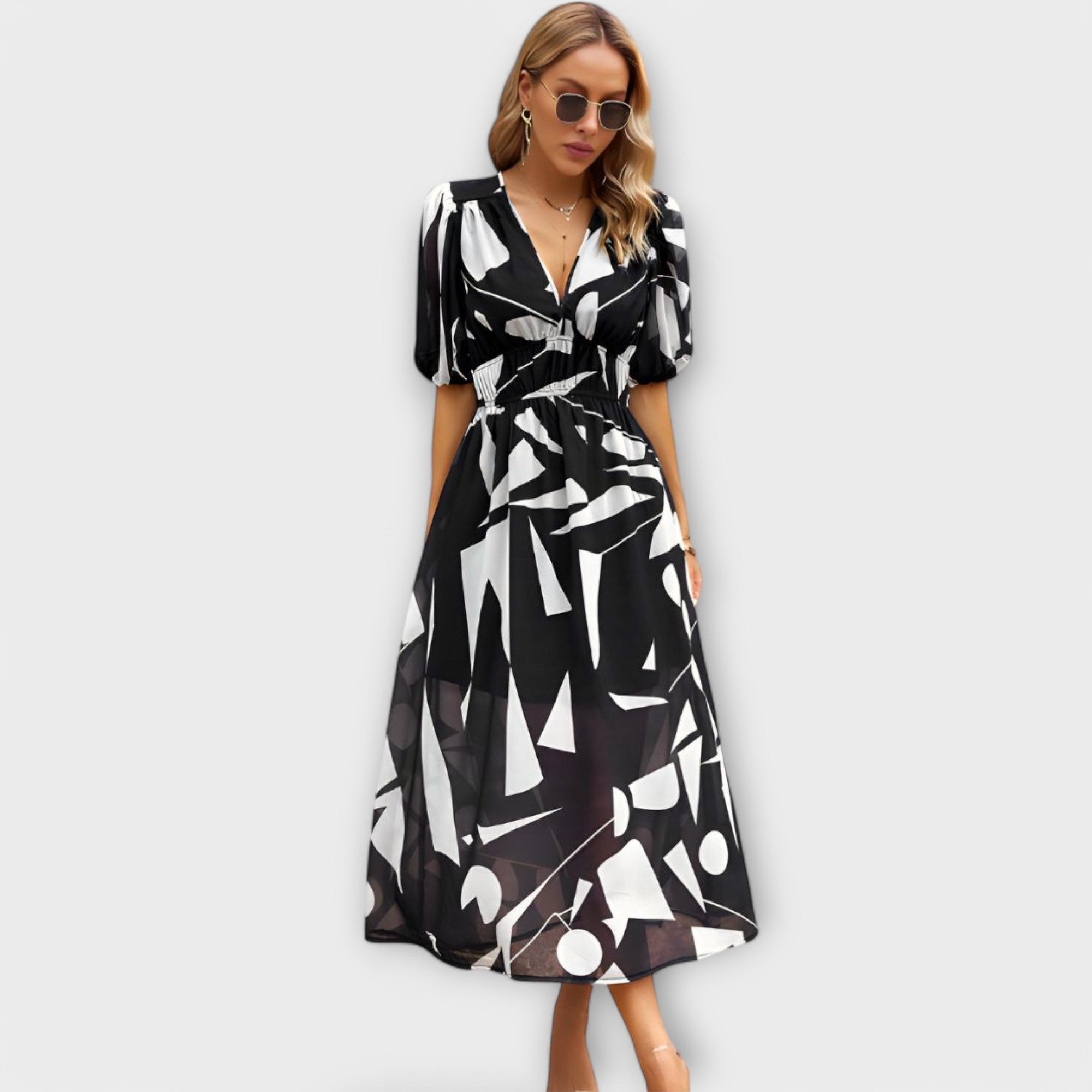 Abstracte maxi-jurk met pofmouwen