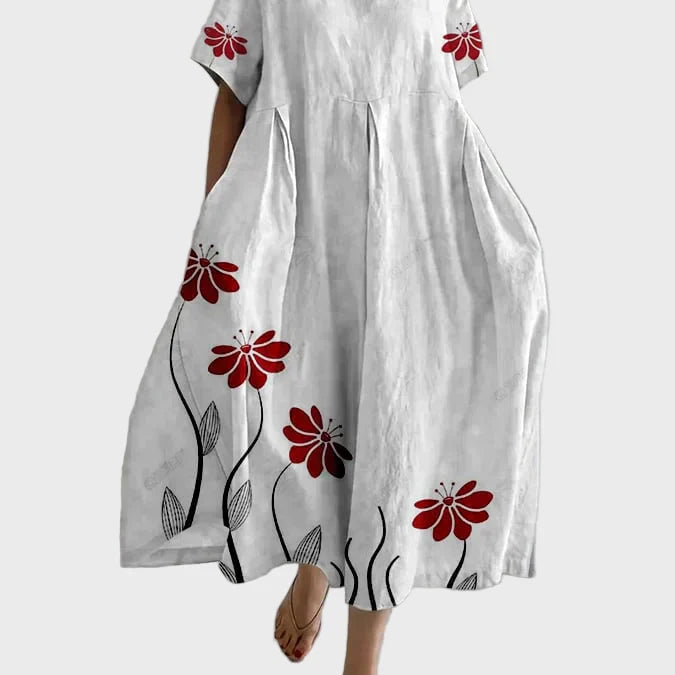 Rosa Kleid mit roten Blütenranken